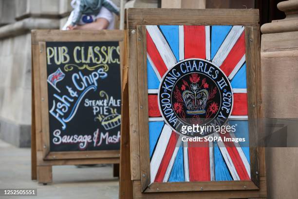 Coronation Union Jack board outside a pub in Westminster, central London as preparations for the Coronation of King Charles III continue. The...