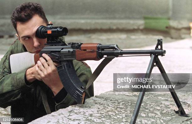 Dragan a Serb fighting on the Bosnian side as a sniper takes aim in Sarajevo 06 September 1992. Dragan says he never shoots at civilians, only at...