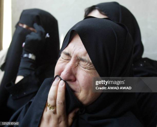 The grandmother of Palestinian teenager Khaled Nasser weeps during his funeral in the Gaza Strip refugee camp of Jabalia 19 May 2003. The Israeli...