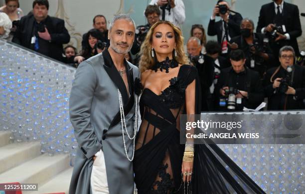 British singer-songwriter Rita Ora and New Zealand director and actor Taika Waititi arrive for the 2023 Met Gala at the Metropolitan Museum of Art on...