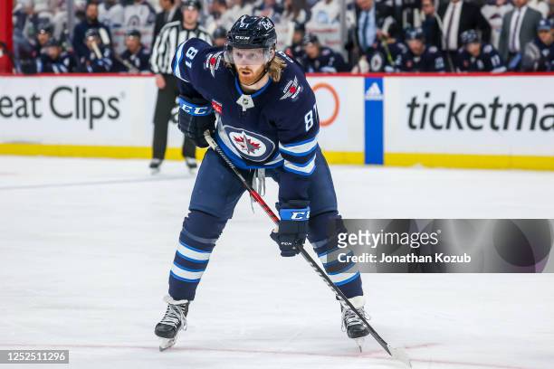 Kyle Connor of the Winnipeg Jets prepares for a second period face-off against the Vegas Golden Knights in Game Four of the First Round of the 2023...
