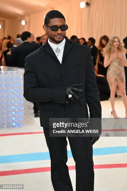 Singer Usher arrives for the 2023 Met Gala at the Metropolitan Museum of Art on May 1 in New York. - The Gala raises money for the Metropolitan...