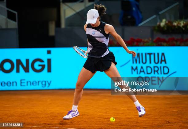 Iga Swiatek of Poland in action against Ekaterina Alexandrova from Russia in the fourth round on Day Eight of the Mutua Madrid Open at La Caja Magica...