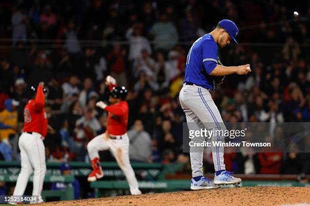 Pitcher Jose Berrios of the Toronto Blue Jays walks back up the mound after giving up a two-run home run to Enmanuel Valdez of the Boston Red Sox,...