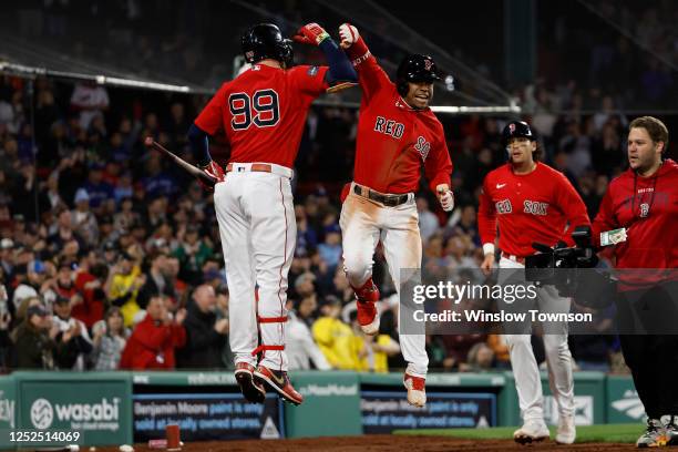 Enmanuel Valdez of the Boston Red Sox celebrates with Alex Verdugo after his two-run home run against the Toronto Blue Jays during the sixth inning...