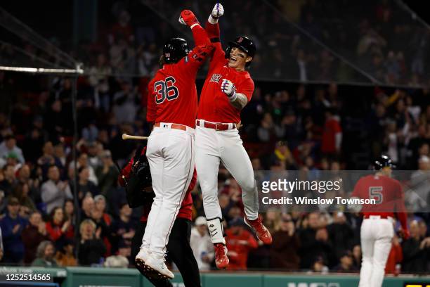 Jarren Duran of the Boston Red Sox celebrates his home run with Triston Casas during the sixth inning against the Toronto Blue Jays at Fenway Park on...