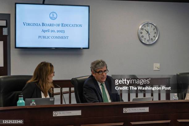 State Superintendent Dr. Lisa Coons, and President Mr. Daniel Gecker chat during a public comment meeting in the James Monroe building on Thursday...