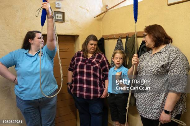 Year-old Luke Eperon takes part in a bell ringing practice session with instructors Becca Hardy , Lizzie Hardy and Rhiannon Meredith at Bromley...