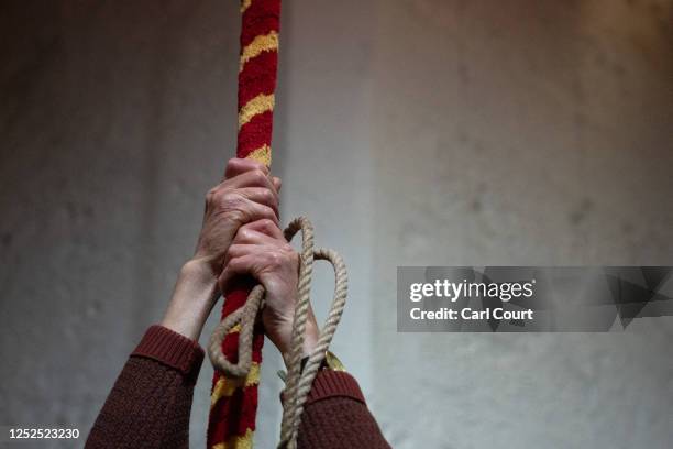 Bell ringer pulls a rope during a practice session at Southwark Cathedral on April 12, 2023 in London, England. Throughout Britain plans are being...