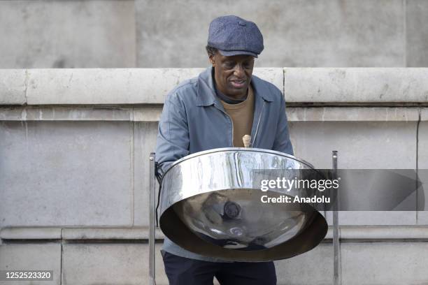 Street performer plays steelpan at subway entrances in London, United Kingdom on May 01, 2023.