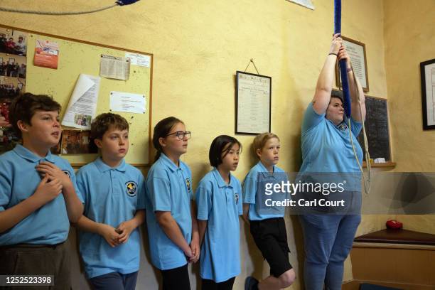 Youngsters look on as bell ringing instructor Becca Hardy waits to pull the bell rope during a bell ringing practice session at Bromley Parish Church...