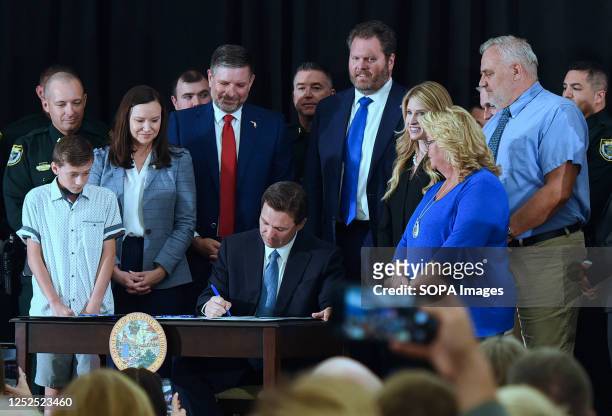 Florida Governor Ron DeSantis signs three bills into law at a press conference at the American Police Hall of Fame & Museum in Titusville. DeSantis...