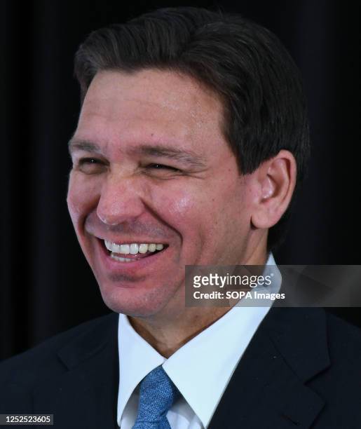 Florida Governor Ron DeSantis laughs at a press conference at the American Police Hall of Fame & Museum in Titusville. DeSantis used the event to...
