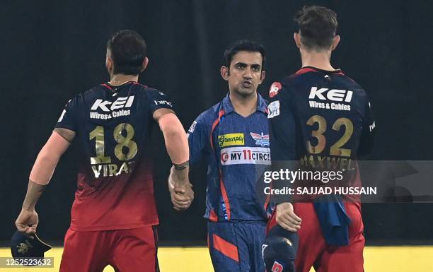 Lucknow Super Giants' team mentor Gautam Gambhir shakes hands with Royal Challengers Bangalore's Virat Kohli and Glenn Maxwell at the end of the...