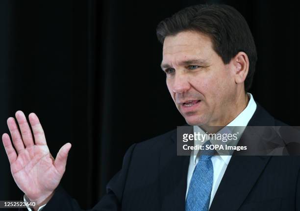 Florida Governor Ron DeSantis waves at a press conference at the American Police Hall of Fame & Museum in Titusville. DeSantis used the event to sign...