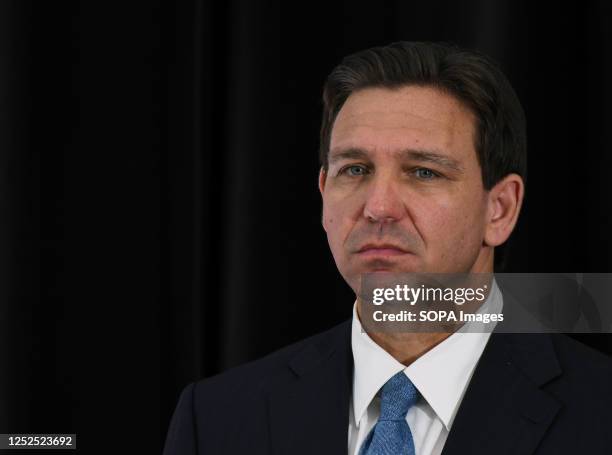 Florida Governor Ron DeSantis listens to a speaker at a press conference at the American Police Hall of Fame & Museum in Titusville. DeSantis used...