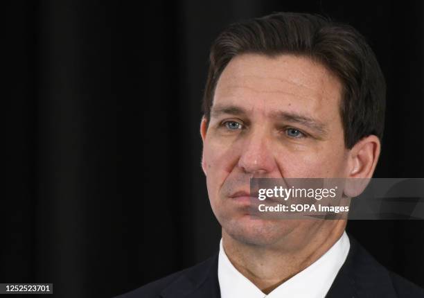 Florida Governor Ron DeSantis listens to a speaker at a press conference at the American Police Hall of Fame & Museum in Titusville. DeSantis used...