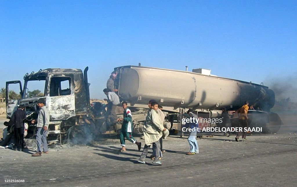 Iraq Fire Engine Iraqis celebrate the destruction of a tanker truck travelling in a US ...