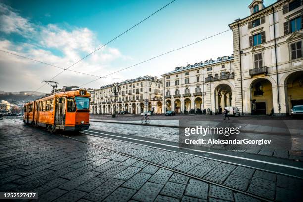 old tram on main street in turin, italy - turin stock pictures, royalty-free photos & images