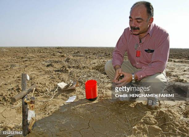 Fernando Suarez, from Escondido, CA, father of Jesus Suarez, a US soldier killed during the US-led war on Iraq in March 2003, prays over the site...