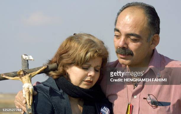 Fernando Suarez , from Escondido, CA, father of Jesus Suarez, a US soldier killed during the US-led war on Iraq 27 March 2003, embraces Anabelle...