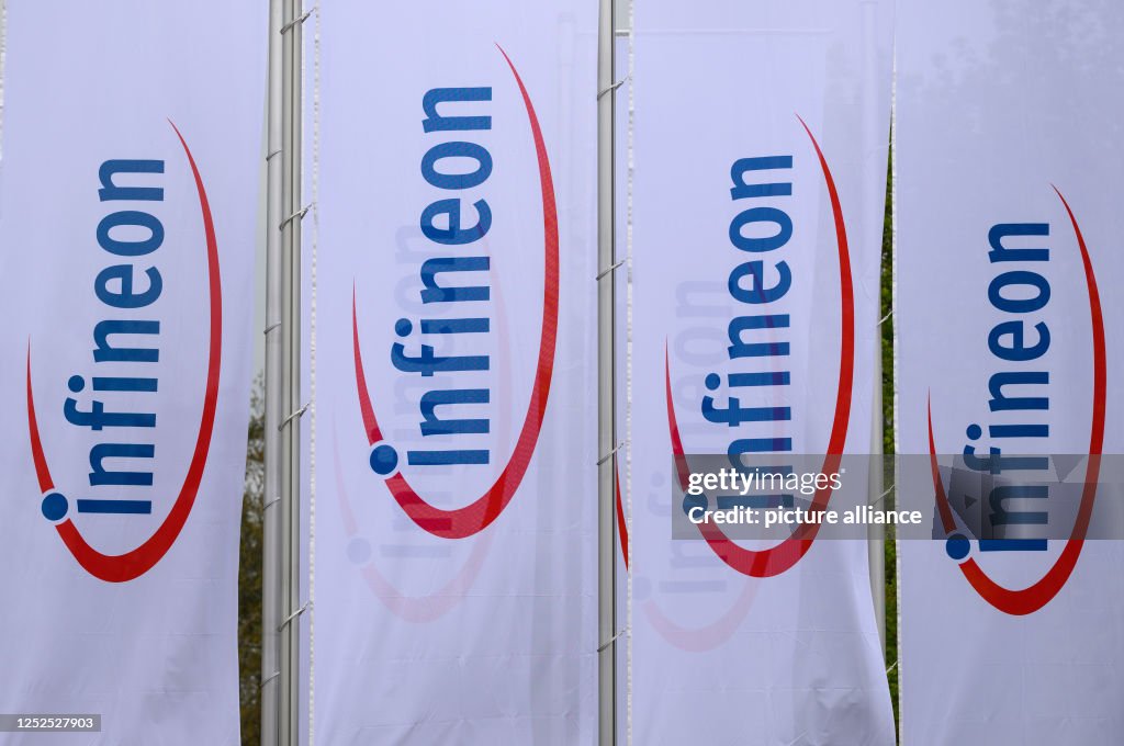 Infineon Rudal Flags with the Infineon logo flutter in the wind in front of the ...