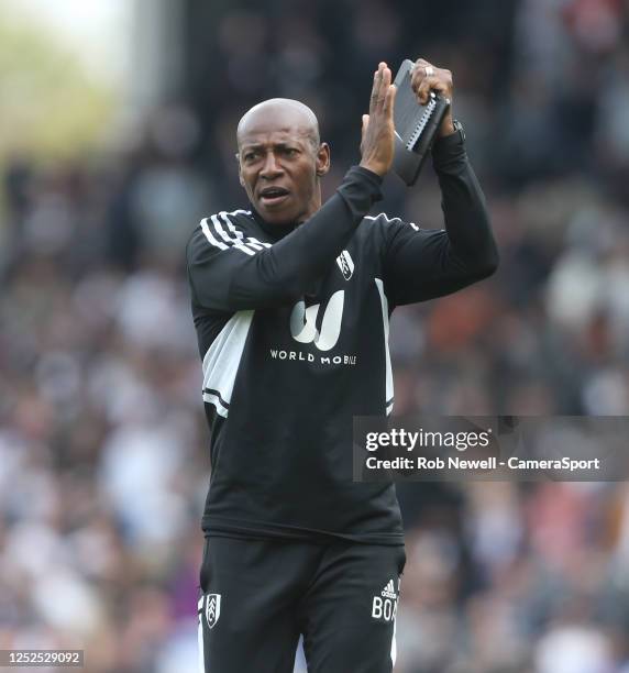 Fulham coach Luis Boa Morte applauds the fans at the final whistle during the Premier League match between Fulham FC and Manchester City at Craven...
