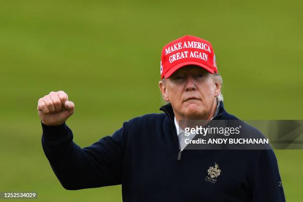 Former US President Donald Trump reacts as he plays golf at the Trump Turnberry Golf Courses, in Turnberry on the west coast of Scotland on May 2...