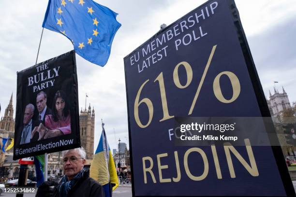 Anti-Brexit protesters continue their campaign against Brexit and the Conservative government in Westminster with a placard claiming that 61% of...