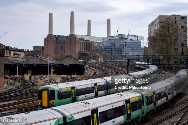 Trains on railway lines at Abbots Manor coming from over the river near Battersea Power Station into London Victoria on 26th April 2023 in London,...