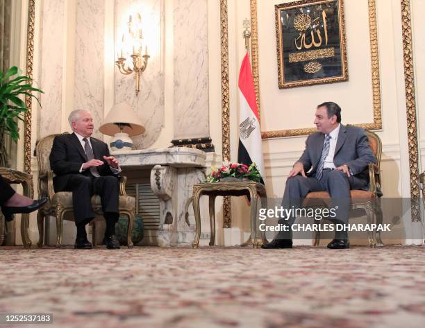 Defense Secretary Robert Gates meets with Egypt's interim Prime Minister Essam Sharaf in Cairo, March 23, 2011. Gates on Wednesday condemned as an...
