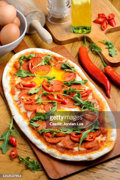 fiery beef pizza - rectangle pizza stock pictures, royalty-free photos & images