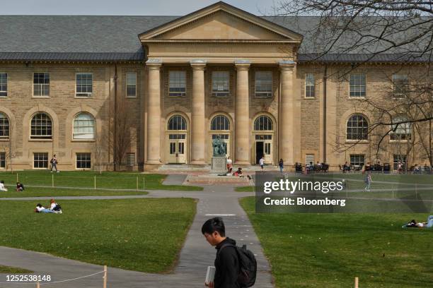Students outside Goldwin Smith Hall at the Cornell University campus in Ithaca, US, on Tuesday, April 11, 2023. US college costs just keep climbing...