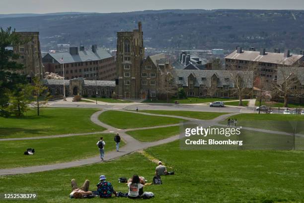 Students on Libe Slope at the Cornell University campus in Ithaca, US, on Tuesday, April 11, 2023. US college costs just keep climbing and the...