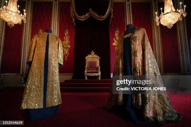 The Coronation Vestments, comprising of the Supertunica and the Imperial Mantle are displayed in the Throne Room at Buckingham Palace in London on...