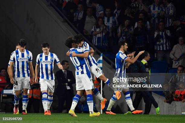 Real Sociedad's Japanese forward Takefusa Kubo celebrates his goal with Real Sociedad's Spanish midfielder Mikel Oyarzabal during the Spanish league...