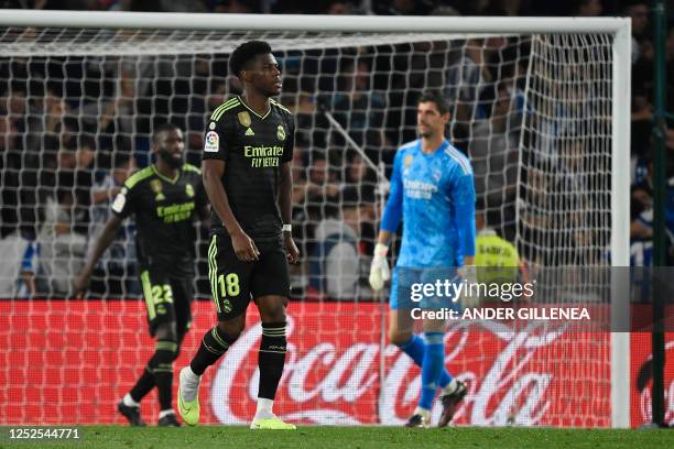 Real Madrid's French defender Aurelien Tchouameni and teammates react to real Sociedad's goal scored by Real Sociedad's Japanese forward Takefusa...