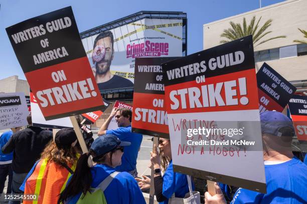 People picket outside of FOX Studios on the first day of the Hollywood writers strike on May 2, 2023 in Los Angeles. Scripted TV series, late-night...