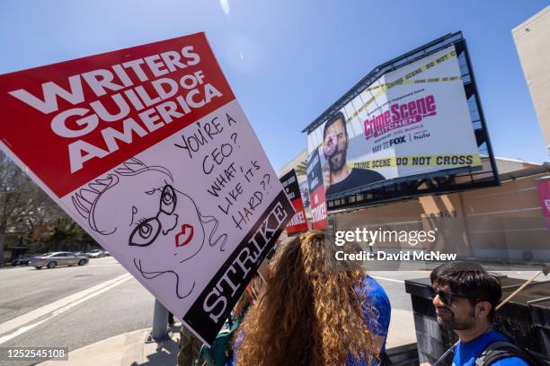 People picket outside of FOX Studios on the first day of the Hollywood writers strike on May 2, 2023 in Los Angeles. Scripted TV series, late-night...