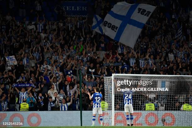 Real Sociedad fans celebrate their team's win at the end of the Spanish league football match between Real Sociedad and Real Madrid CF at the Reale...