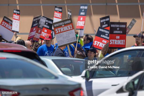 People picket outside of FOX Studios on the first day of the Hollywood writers strike on May 2, 2023 in Los Angeles. Scripted TV series, late-night...