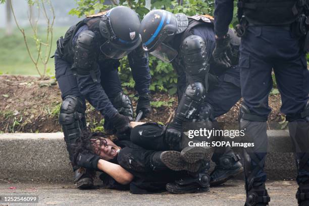 Protester is arrested by police during the clashes of labor day. Labor Day in France was marked by hundreds of arrests, as well as several police...