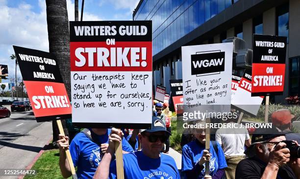 Writers picket in front of Netflix on Sunset Boulevard in Hollywood, California, on May 2, 2023 as the Writers Guild of America goes on strike. -...