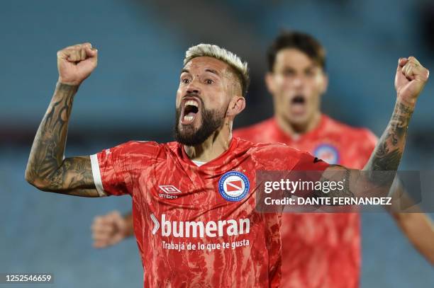 Argentinos Juniors' defender Miguel Angel Torren celebrates scoring his team's second goal during the Copa Libertadores group stage first leg...