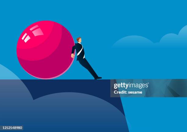 the huge red ball pushed the businessman to the edge of the cliff - sesame balls stock illustrations