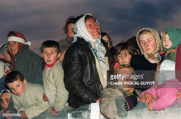 Woman refugee from the Serb-besieged Bosnian enclave of Srebrenica bursts into tears upon her arrival in Tuzla, 29 March 1993, as part of some 2000...