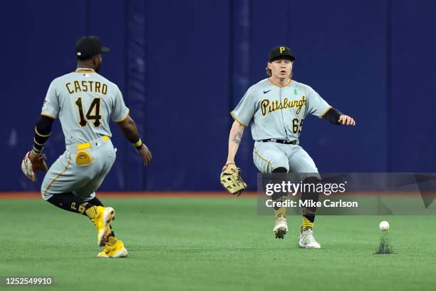 Rodolfo Castro of the Pittsburgh Pirates and teammate Jack Suwinski stare at a ball hit by Jose Siri of the Tampa Bay Rays during the fifth inning at...