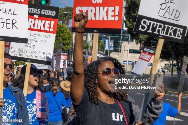 People picket outside of Paramount Pictures on the first day of the Hollywood writers strike on May 2, 2023 in Los Angeles. Scripted TV series,...