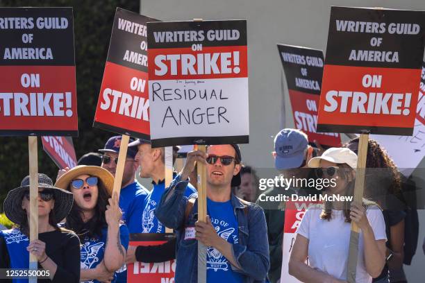 People picket outside of Paramount Pictures on the first day of the Hollywood writers strike on May 2, 2023 in Los Angeles. Scripted TV series,...