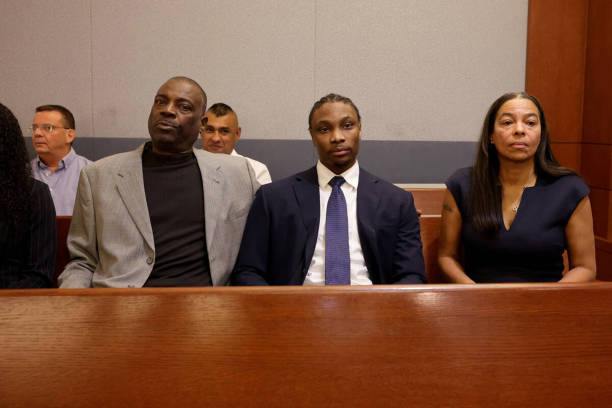 Former Raiders player Henry Ruggs, center, waits in court for a hearing at the Regional Justice Center in Las Vegas Tuesday, May 2, 2023. Attorneys...